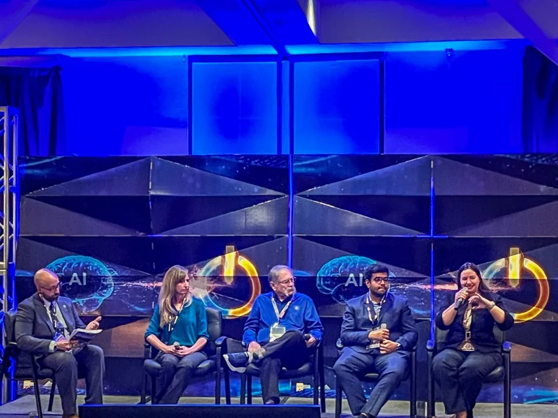 Panelists seated on stage at the AI & Energy Conference in Las Cruces.